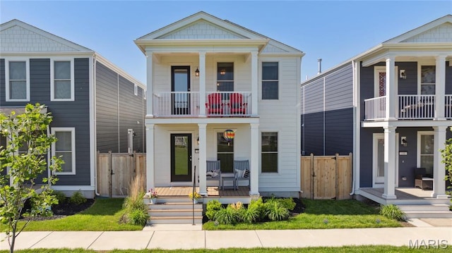 104 Tiber Way, Saint Charles, MO 63301 - greek revival inspired property featuring a porch, a balcony, and a gate