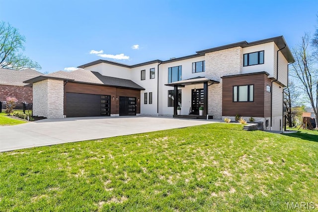 10010 Schuessler Rd, Saint Louis, MO 63128 - view of front facade featuring an attached garage, driveway, stone siding, and a front yard