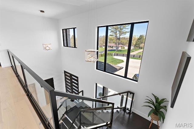 10010 Schuessler Rd, Saint Louis, MO 63128 - stairs featuring wood finished floors and baseboards