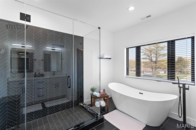 10010 Schuessler Rd, Saint Louis, MO 63128 - bathroom featuring tile patterned floors, a freestanding tub, a shower stall, baseboards, and recessed lighting