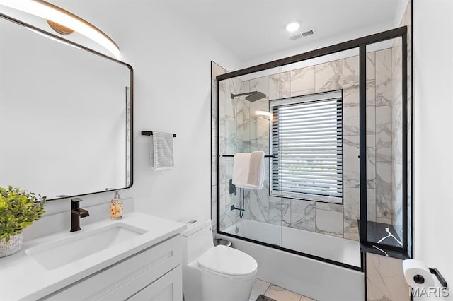 10010 Schuessler Rd, Saint Louis, MO 63128 - full bathroom featuring combined bath / shower with glass door, vanity, and toilet