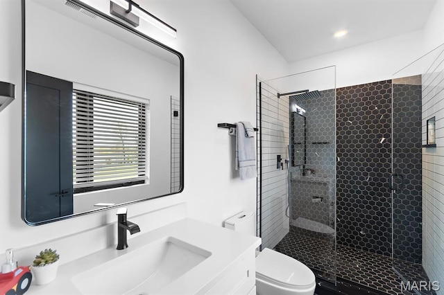 10010 Schuessler Rd, Saint Louis, MO 63128 - bathroom with a shower stall, toilet, vanity, and recessed lighting