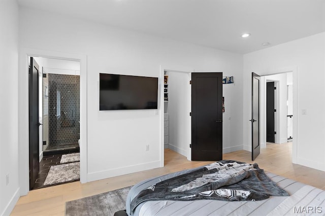 10010 Schuessler Rd, Saint Louis, MO 63128 - bedroom with wood finished floors, baseboards, and recessed lighting