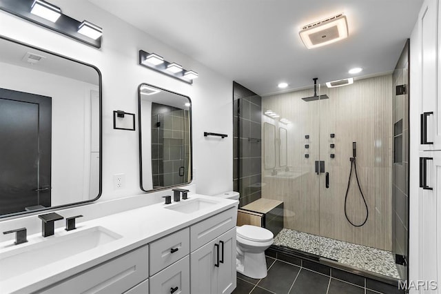 10010 Schuessler Rd, Saint Louis, MO 63128 - full bathroom featuring tile patterned flooring, a shower stall, toilet, double vanity, and recessed lighting