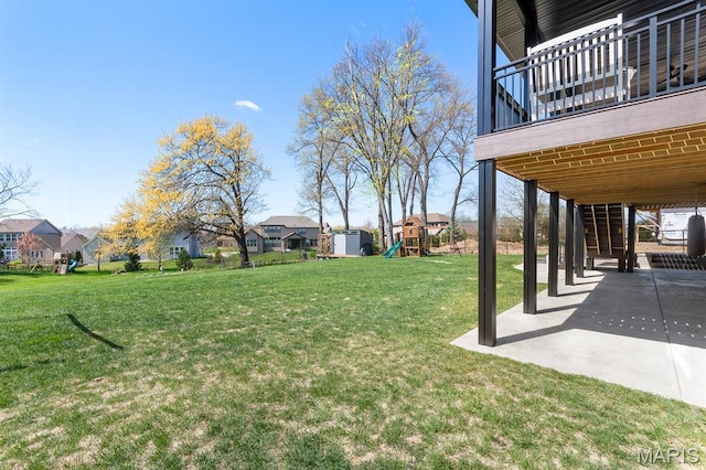 10010 Schuessler Rd, Saint Louis, MO 63128 - view of grassy yard featuring a playground, a patio area, and a residential view