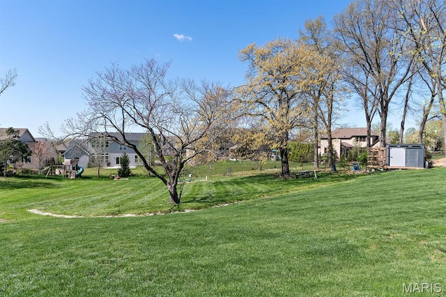10010 Schuessler Rd, Saint Louis, MO 63128 - view of green lawn with a storage shed and an outdoor structure