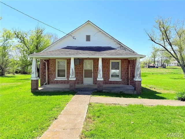 5920 County Rd 20, Belleview, MO 63623 - bungalow-style home featuring a porch, a front lawn, roof with shingles, and stone siding