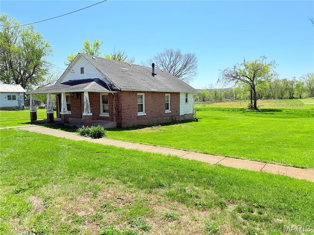 5920 County Rd 20, Belleview, MO 63623 - view of front of home with a porch and a front lawn