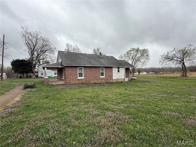 5920 County Rd 20, Belleview, MO 63623 - view of side of home with a lawn