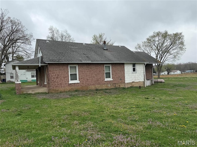 5920 County Rd 20, Belleview, MO 63623 - rear view of property featuring roof with shingles and a lawn