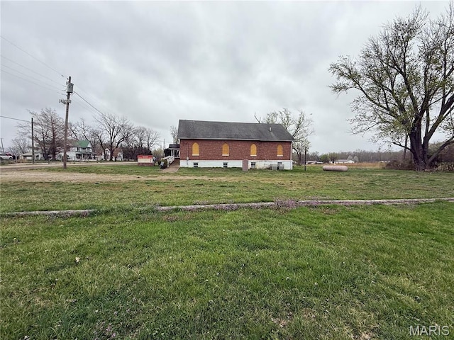 5920 County Rd 20, Belleview, MO 63623 - rear view of house with a lawn