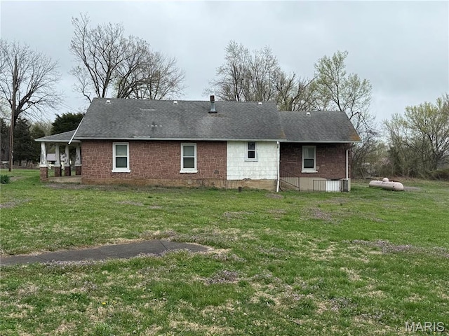 5920 County Rd 20, Belleview, MO 63623 - rear view of property with a lawn and a shingled roof