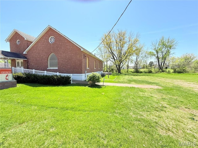 5920 County Rd 20, Belleview, MO 63623 - view of property exterior featuring a yard and brick siding