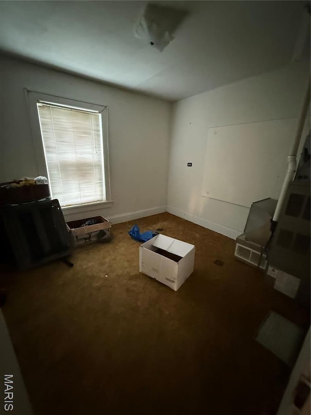 5920 County Rd 20, Belleview, MO 63623 - empty room featuring carpet flooring and baseboards