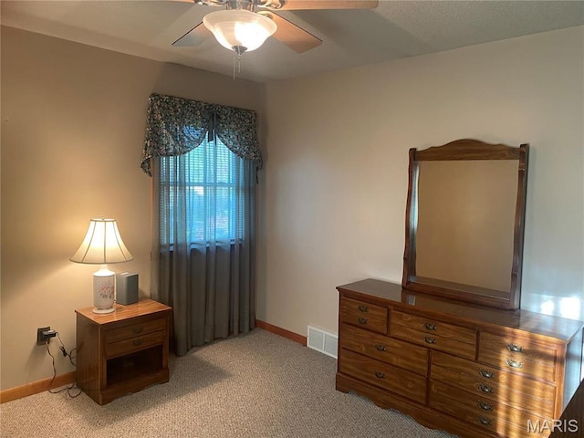 bedroom with light carpet, baseboards, and ceiling fan