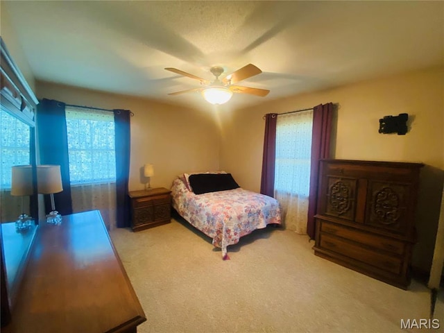 bedroom featuring carpet and ceiling fan