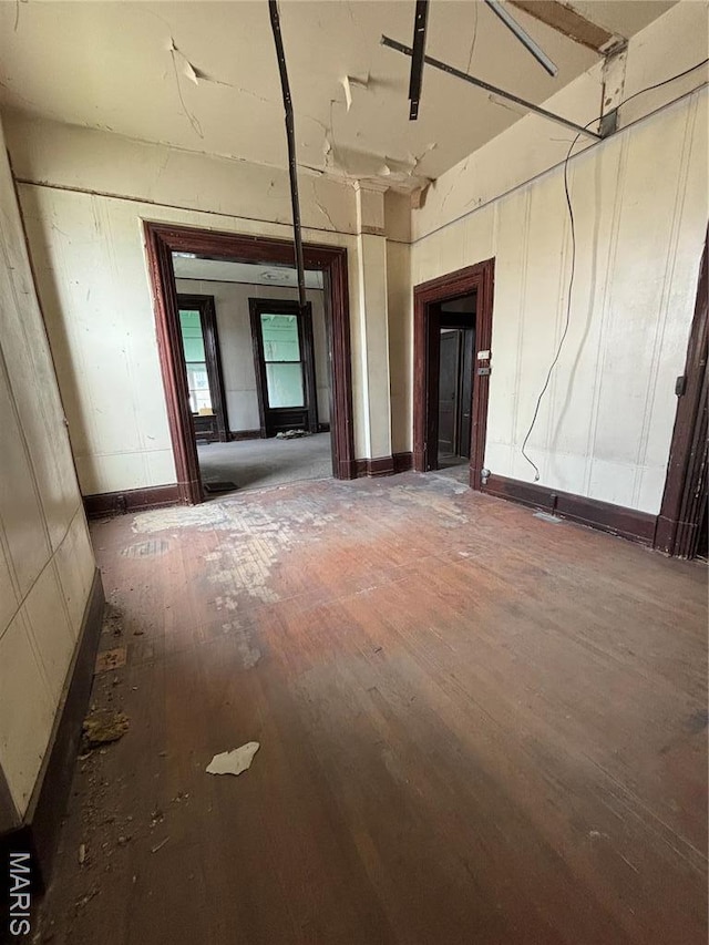 spare room with wood finished floors