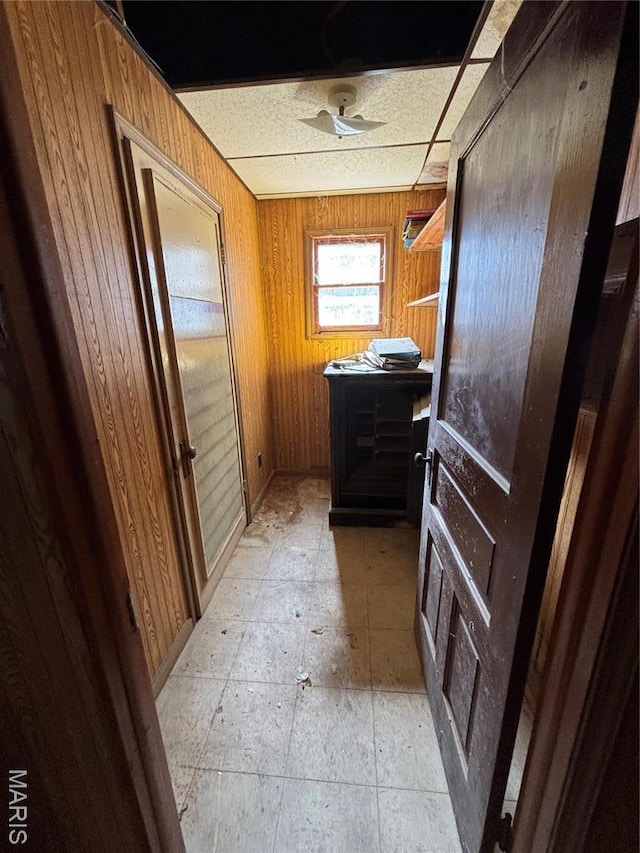 bathroom featuring wood walls