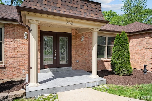 362 Hibler Ct, Saint Louis, MO 63141 - doorway to property with a shingled roof, french doors, brick siding, and covered porch