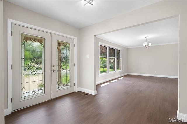 362 Hibler Ct, Saint Louis, MO 63141 - entrance foyer featuring baseboards, a chandelier, dark wood-style floors, french doors, and ornamental molding