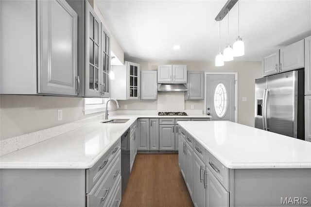 362 Hibler Ct, Saint Louis, MO 63141 - kitchen with gray cabinets, appliances with stainless steel finishes, a sink, a kitchen island, and glass insert cabinets