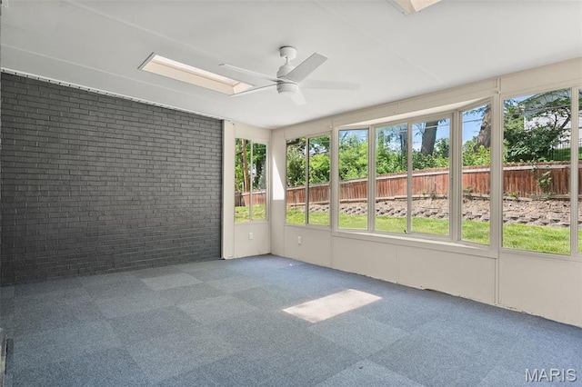 362 Hibler Ct, Saint Louis, MO 63141 - unfurnished sunroom with brick wall, carpet floors, ceiling fan, and a skylight