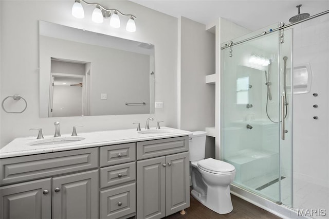 362 Hibler Ct, Saint Louis, MO 63141 - bathroom with a shower stall, double vanity, toilet, and wood finished floors