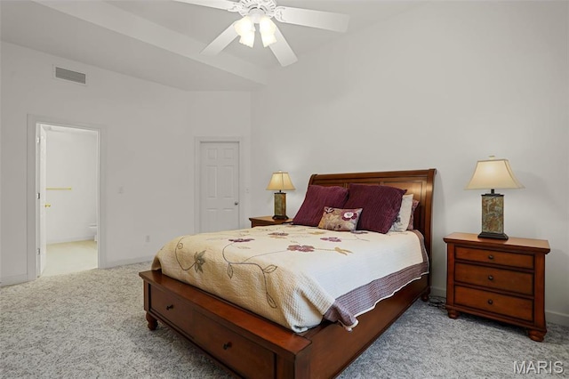 carpeted bedroom with connected bathroom, a ceiling fan, and baseboards