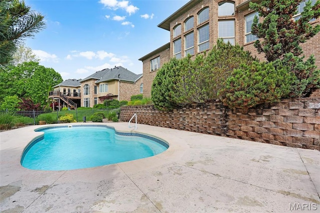 view of pool featuring fence and a patio area