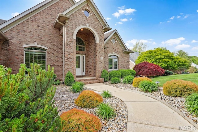 traditional-style house featuring brick siding