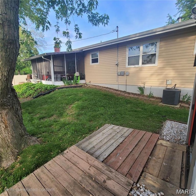2 Hyannis Ct, Saint Charles, MO 63301 - rear view of property with a sunroom, a wooden deck, and a yard