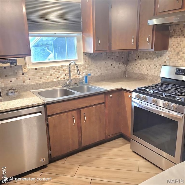 2 Hyannis Ct, Saint Charles, MO 63301 - kitchen featuring stainless steel appliances, under cabinet range hood, and tasteful backsplash