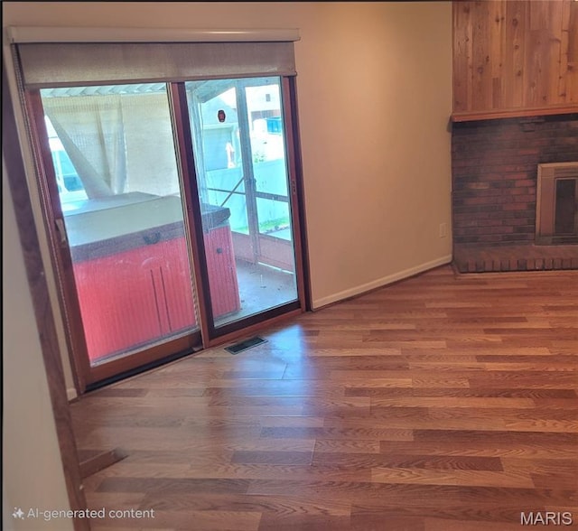 2 Hyannis Ct, Saint Charles, MO 63301 - unfurnished living room featuring wood finished floors and baseboards