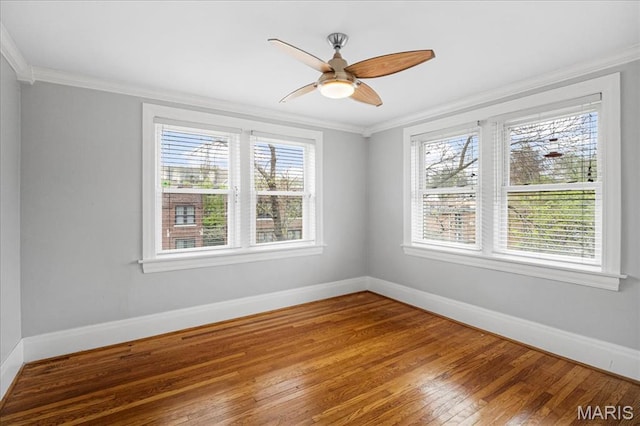 7570 Byron Pl Unit 3W, Saint Louis, MO 63105 - unfurnished room with baseboards, ornamental molding, wood-type flooring, and a ceiling fan