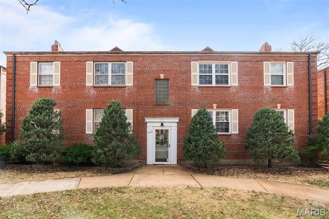 5872 Sunshine Dr Unit 110, Saint Louis, MO 63109 - view of front of property featuring a chimney and brick siding