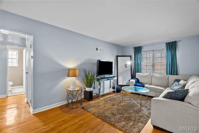 5872 Sunshine Dr Unit 110, Saint Louis, MO 63109 - living room with wood finished floors and baseboards