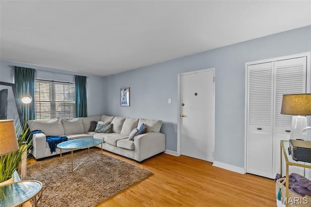 5872 Sunshine Dr Unit 110, Saint Louis, MO 63109 - living area with wood finished floors and baseboards