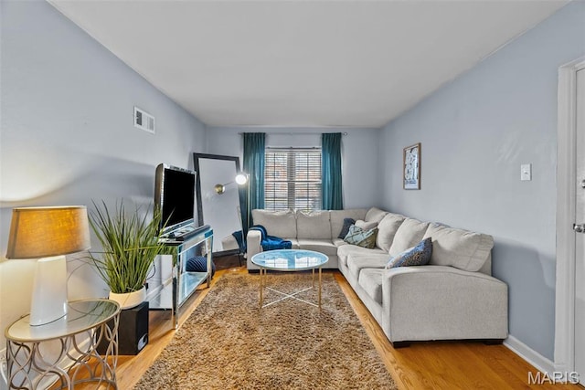 5872 Sunshine Dr Unit 110, Saint Louis, MO 63109 - living area with wood finished floors