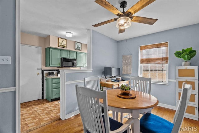 5872 Sunshine Dr Unit 110, Saint Louis, MO 63109 - dining space with a ceiling fan and light wood finished floors