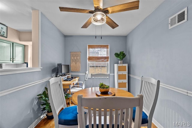 5872 Sunshine Dr Unit 110, Saint Louis, MO 63109 - dining space with baseboards, ceiling fan, and wood finished floors