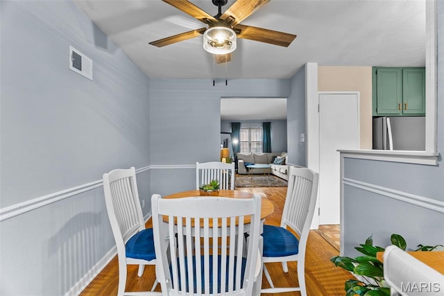 5872 Sunshine Dr Unit 110, Saint Louis, MO 63109 - dining room with a ceiling fan and wood finished floors
