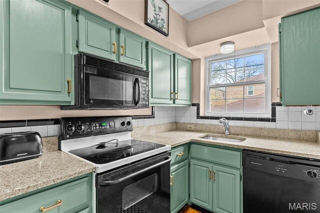 5872 Sunshine Dr Unit 110, Saint Louis, MO 63109 - kitchen with black appliances, a sink, light countertops, and backsplash