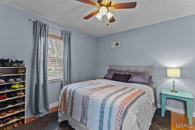 5872 Sunshine Dr Unit 110, Saint Louis, MO 63109 - bedroom with baseboards and a ceiling fan