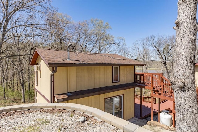 13145 Wanda Lee Ln, Saint Genevieve, MO 63670 - rear view of property with roof with shingles, a wooden deck, and stairway