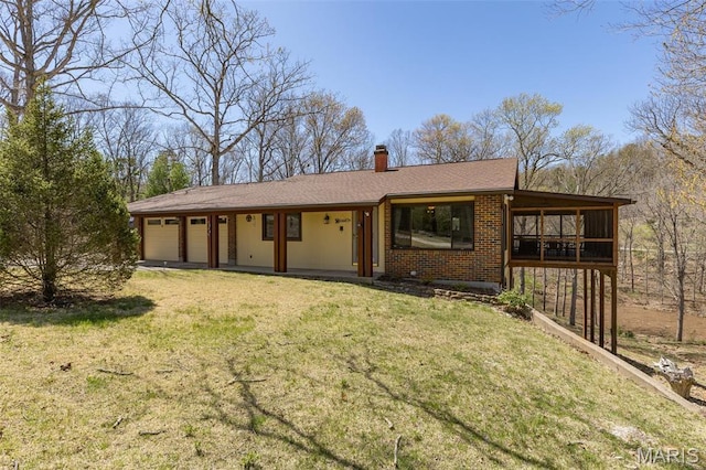 13145 Wanda Lee Ln, Saint Genevieve, MO 63670 - back of house with a chimney, a garage, a yard, and brick siding