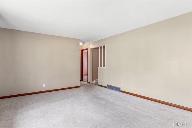 8907 Spur Ln, Saint Louis, MO 63121 - carpeted spare room with baseboards