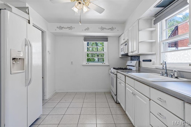 8907 Spur Ln, Saint Louis, MO 63121 - kitchen featuring white appliances, a sink, healthy amount of natural light, and ceiling fan