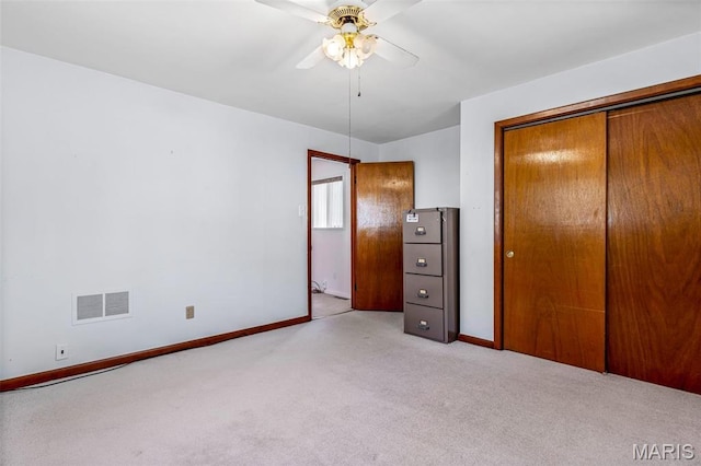8907 Spur Ln, Saint Louis, MO 63121 - unfurnished bedroom featuring light carpet, baseboards, a closet, and ceiling fan