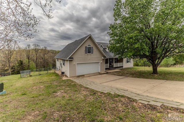 20373 Heritage Rd, Saint Robert, MO 65584 - view of front of property featuring concrete driveway, roof with shingles, and covered porch