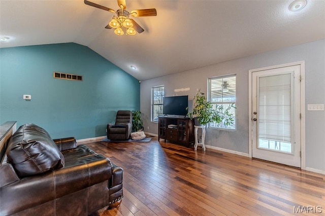 20373 Heritage Rd, Saint Robert, MO 65584 - living room featuring a ceiling fan, vaulted ceiling, hardwood / wood-style floors, and baseboards